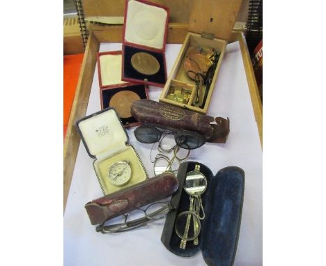 A cased set of scales, together with various spectacles, a compass, an Edward VII Coronational medal and a Victoria medal 183