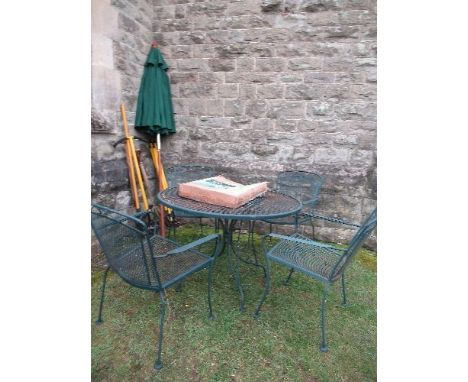 A set of green metal garden furniture, together with parasol, and garden tools