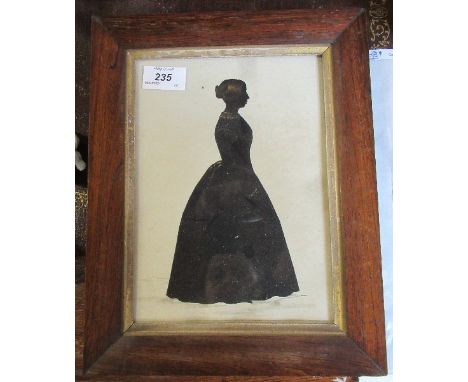 A 19th century black silhouette of a full length portrait of a lady in a dress, 9ins x 6.5ins, together with an unframed wate