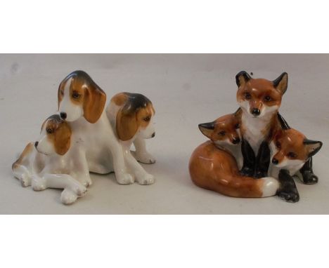 A Royal Worcester model of fox hounds, shape number 3132, circa 1949, height 2.25ins, together with a model of fox cubs, shap