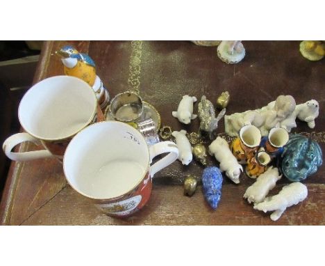 A collection of porcelain and other models, to include frogs, seals pigs, rabbits, and a Royal Worcester kingfisher candle sn