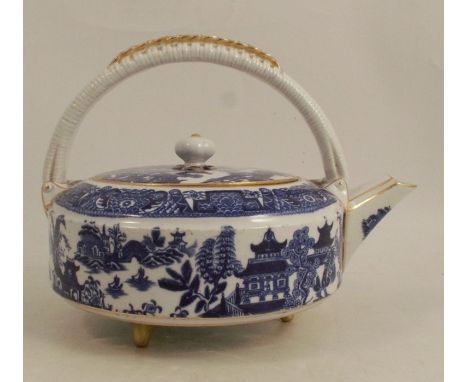 A Royal Worcester tea pot, printed with a blue and white willow pattern, with fixed wicker moulded handle over, dated 1881, h