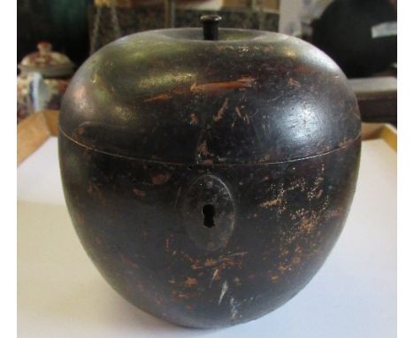 An antique tea caddy formed as an apple