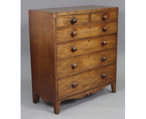 An early 19th century chest, with plain rectangular top, fitted two short &amp; four long graduated drawers with turned woode