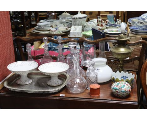 A brass oil table lamp (converted to electricity); together with three glass decanters; a pair of comports, etc.