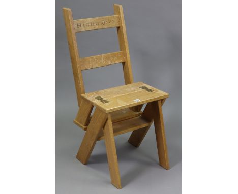 A light oak metamorphic library step/chair, the back rail inscribed: “HIGHGROVE”.