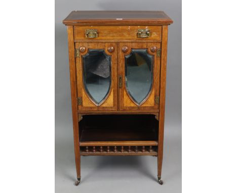 A 19th century inlaid-rosewood upright sheet-music cabinet fitted with a frieze drawer above a pair of bevelled mirror doors 