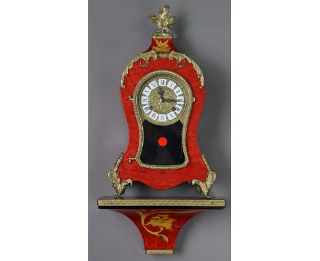 A reproduction bracket clock with black roman numerals to the brass &amp; white enamel two-part dial, &amp; in red lacquered 