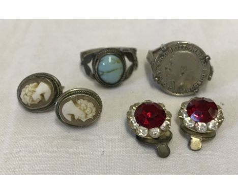 2 silver rings together with a pair of paste clip on earrings and a pair of cameo stud earrings. A signet style ring set with