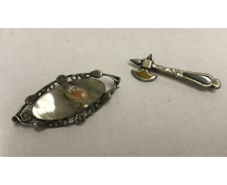 2 vintage silver brooches. One in the shape of an axe set with natural agates and the other set with central oval natural mot
