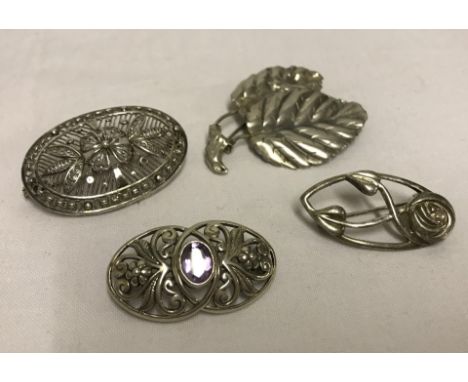 4 silver and white metal brooches. To include amethyst set and Rennie Mackintosh style. 