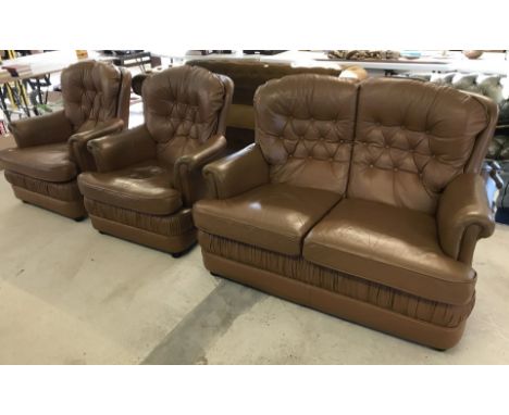 A light brown leather 3 piece suite. Comprising; 2 seater settee and 2 arm chairs. 