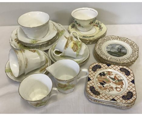 A box of assorted bone china part tea wares. To include Melba china tea set and "Orient" tea plates by H.H.& G. Ltd. 