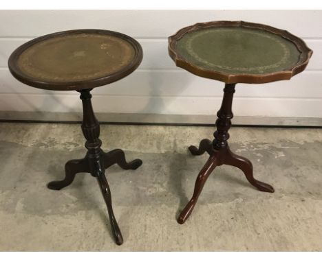 2 tripod legged wine tables with leather tops and turned detail to pedestal.  