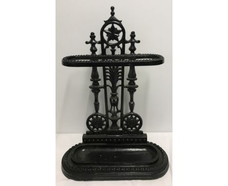 A vintage cast iron stick stand. Painted black. 