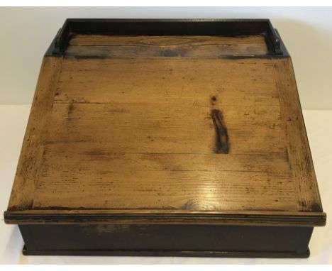 A vintage pine slope fronted desk top with lift up lid and internal shelf.  Approx. 60cm x 52cm x 34cm.