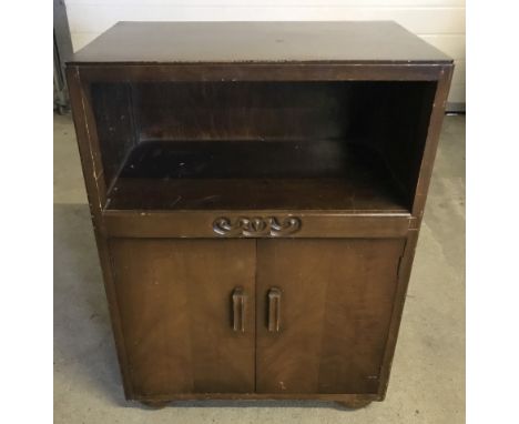 Vintage 2 door cabinet with shelf and carved detail to front.  71cm tall x 53cm wide. 