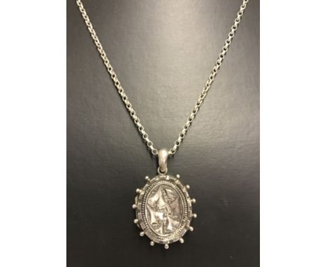 A Victorian silver locket on a sterling silver chain. Locket hallmarked Birmingham 1890. Chain length 24 inches. 