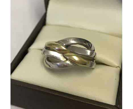 A 14k 2 colour gold ring with twist design. Stamped 585, looks to have been resized. Being sold on behalf of Chernobyl Childr