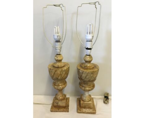 A pair of vintage marble lamp bases together with a pair of cream and gold lampshades.  Approx. 46cm tall with fixings.