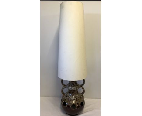 A large brown drip glaze studio pottery 2 handled lamp base. Together with large cream lampshade. Approx. 105cm tall with lam