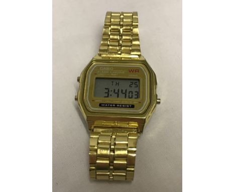 A Casio digital WR mens wrist watch  with gold tone bracelet. With alarm and light function, water resistant. 