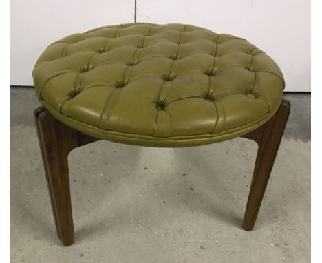 A small round 3 legged Danish Christian Linneberg stool. With light Olive green buttoned seat. Approx. 40cm tall. 