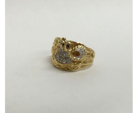 A large heavy gent's 18 carat ring with textured decoration, paved with diamonds. Approx. 18.1 grams. Est. £380 - £420.