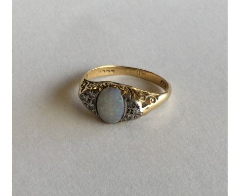 An opal and rose diamond half hoop ring in 18 carat gold. Approx. 4.3 grams. Est. £70 - £90.