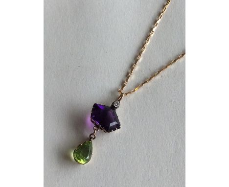 SUFFRAGETTE: An attractive drop pendant with diamond, amethyst and peridot in claw mount on fine link chain with loop top. Ap