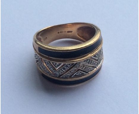 A diamond and enamelled cocktail ring in 9 carat. Approx. 6.3 grams. Est. £65 - £75.