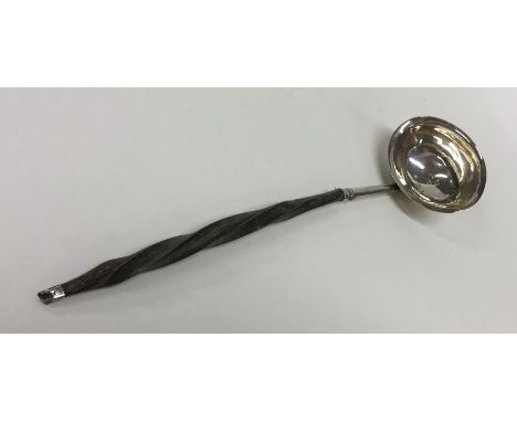 A Georgian silver toddy ladle with whalebone handle. Approx. 14 grams. Est. £25 - £35.