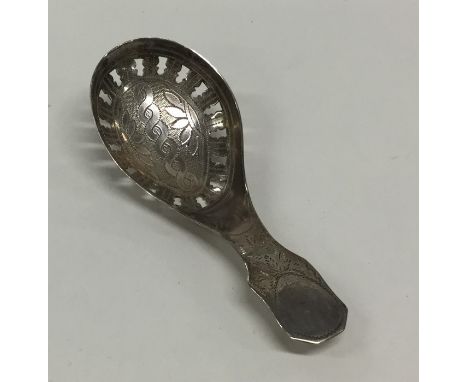 A good Georgian silver bright cut caddy spoon engraved with flowers and leaves. Approx. 8 grams. Est. £60 - £80.