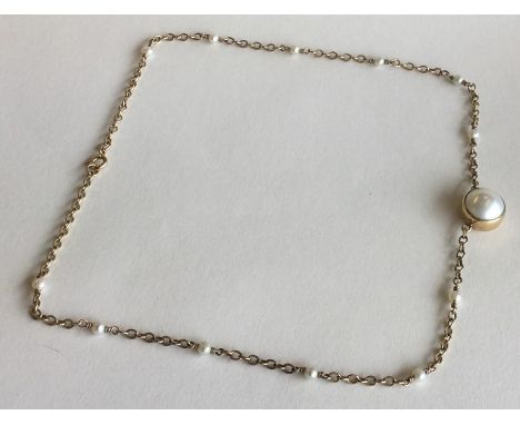 A 9 carat pearl chain with ring clasp. Approx. 8.6 grams. Est. £80 - £120.