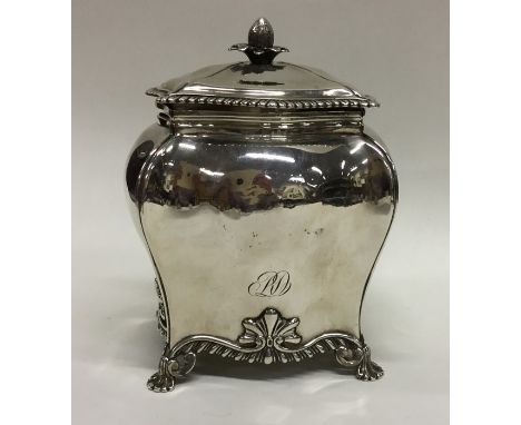 A good George III silver tea caddy on scroll feet with lift-off cover and fruit finial. London. By DR&amp;S. Approx. 294 gram