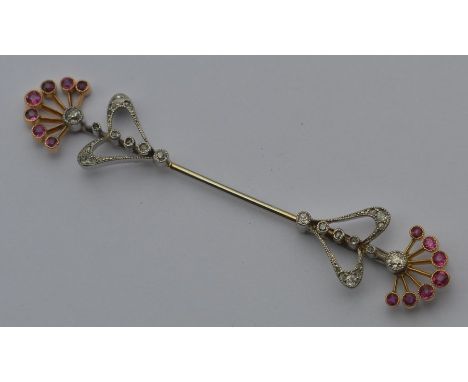 An attractive French diamond and ruby scarf pin in platinum and gold. Approx. 7.2 grams. Est. £800 - £1200.