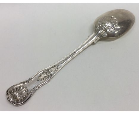 PAUL STORR: A good Kings' pattern dessert spoon with crested armorial. Approx. 52 grams. Est. £100 - £150.