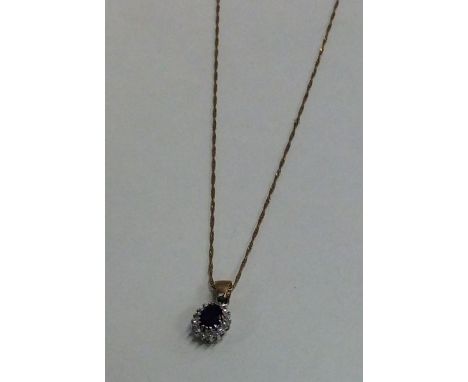 A 9 carat amethyst and diamond pendant on fine link chain. Approx. 2 grams. Est. £30 - £40.