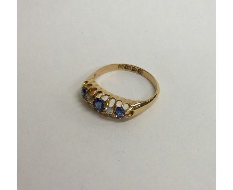 An attractive Victorian 18 carat sapphire and diamond ring. Approx. 3 grams. Est. £60 - £80.