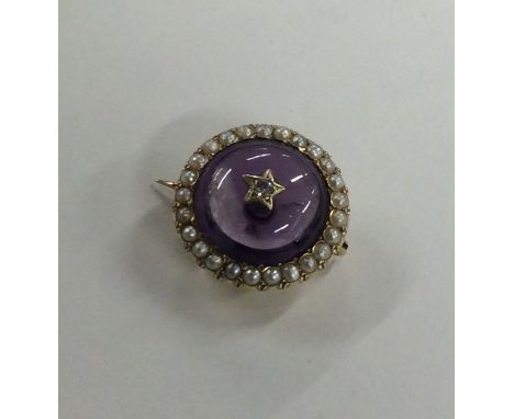 A Victorian amethyst and pearl brooch in gold frame. Approx. 6.9 grams. Est. £200 - £300.