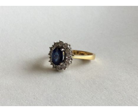 A good 18 carat and platinum sapphire and diamond cluster ring. Approx. 5.5 grams. Est. £200 - £300.