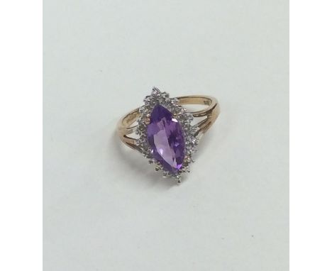 A 9 carat amethyst and diamond marquise shaped cluster ring. Approx. 2.6 grams. Est. £30 - £40.