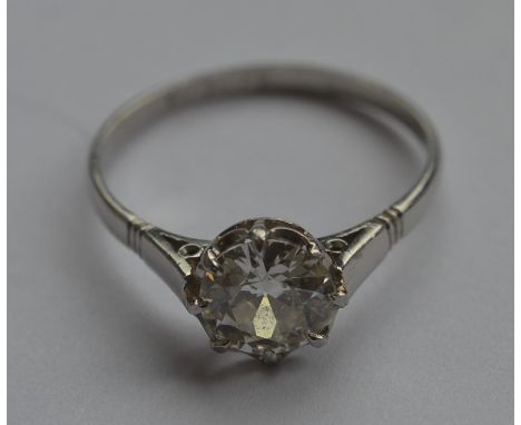 A good French diamond single stone ring in platinum claw mount. Approx. 1.5 carats. Approx. 4 grams. Est. £6000 - £8000.