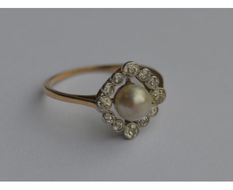 A Victorian pearl and diamond cluster ring in two colour gold setting. Approx. 2.4 grams. Est. £400 - £600.