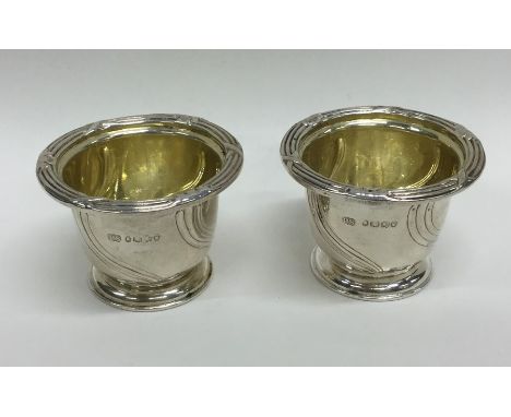 PAUL STORR: A pair of unusual silver salts attractively crested with gilt interiors and swirl decoration. Approx. 92 grams. E