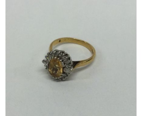 A modern diamond and citrine cluster ring in 18 carat gold. Approx. 4.6 grams. Est. £80 - £120.