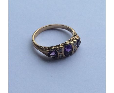 A diamond mounted seven stone ring in gold mount. Approx. 3 grams. Est. £25 - £35.