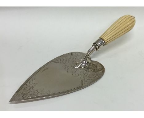 EXETER: A silver engraved trowel with fluted handle. Approx. 188 grams. Est. £50 - £80.