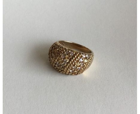 A good quality 9 carat diamond ring with textured body. Approx. 8.6 grams. Est. £80 - £120.