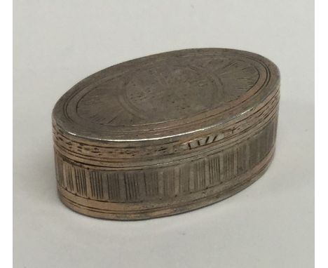 A Georgian oval silver bright cut snuff box with gilt interior. Approx. 34 grams. Est. £60 - £80.